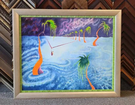 Surreal palms canvas in a pale driftwood frame with a green woven fillet