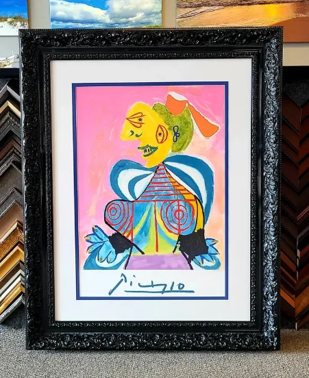 Signed Picasso print, double-matted in white and navy inside a carved black ornate moulding