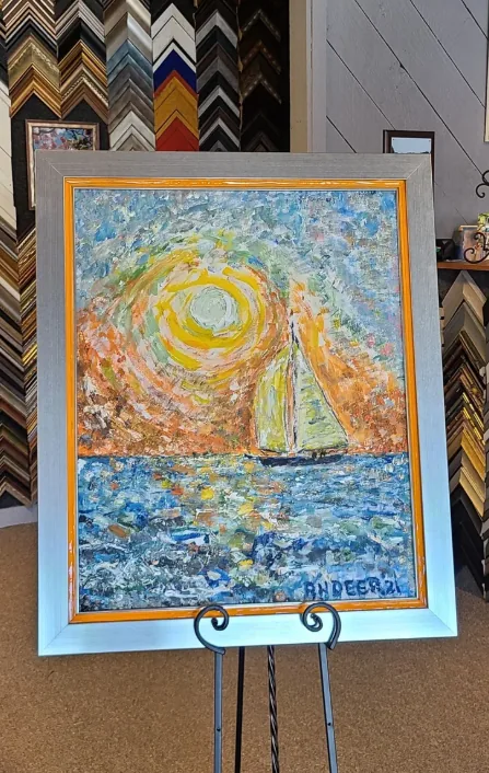 Impasto sailboat painting in a brushed-silver moulding with an orange fillet
