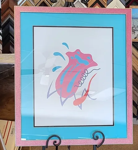 Rolling Stones tongue print matted in turquoise with a pink glitter moulding
